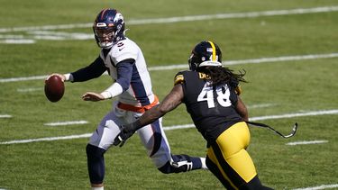 Lock sale lesionado y Steelers frenan remontada de Broncos