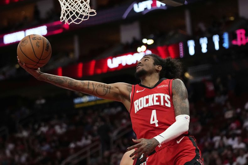 El escolta de los Rockets de Houston, Jalen Green (4), dispara durante la primera mitad de un partido de baloncesto de la NBA contra los Bulls de Chicago en Houston, el sábado 15 de marzo de 2025. (AP Foto/Ashley Landis)