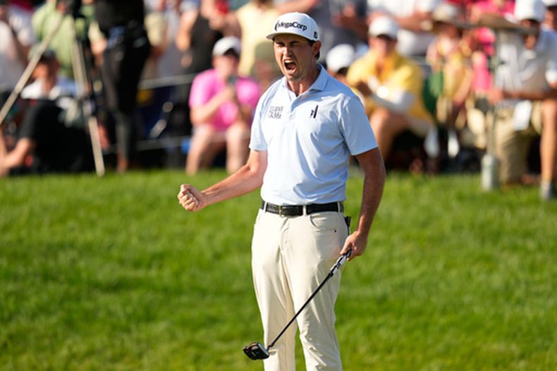 J.T. Poston celebra después de ganar el torneo de golf Memorial, el domingo 7 de junio de 2026, en Dublin, Ohio. (AP Foto/Sue Ogrocki)
