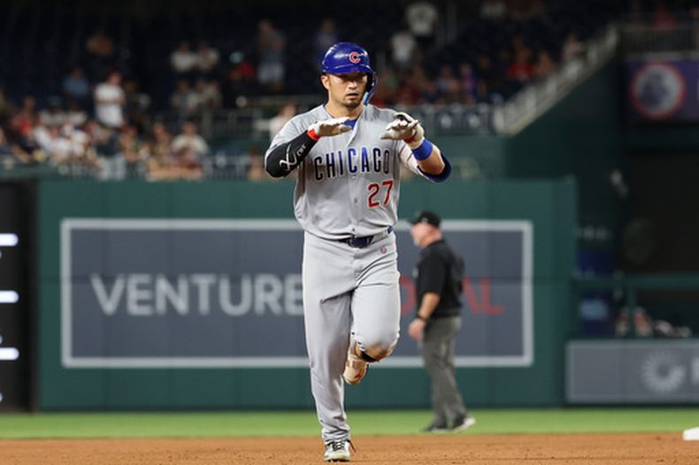 Seiya Suzuki, de los Cachorros de Chicago, recorre las bases luego de pegar un jonrón ante los Nacionales de Washington, el martes 11 de agosto de 2026 (AP Foto/Terrance Williams)