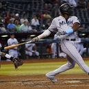 El dominicano Jesús Sánchez, de los Marlins de Miami, conecta un jonrón de tres carreras en el juego ante los Diamondbacks de Arizona, el miércoles 10 de mayo de 2023 (AP Foto/Matt York)