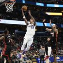 Wizards ganan 107-106 a Heat en tiempo extra
