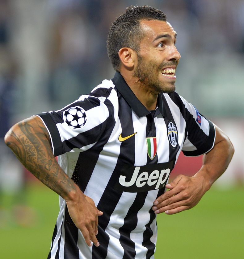 Carlos Tevez celebra tras anotar un gol para Juventus en el partido ante Malmo por la Liga de Campeones el martes 16 de septiembre de 2014. (AP Foto/Massimo Pinca)