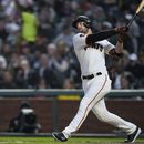 San Francisco Giants Austin Slater watches his two-run home run against the Oakland Athletics during the sixth inning of a baseball game Wednesday, July 26, 2023, in San Francisco. (AP Photo/Godofredo A. Vásquez)