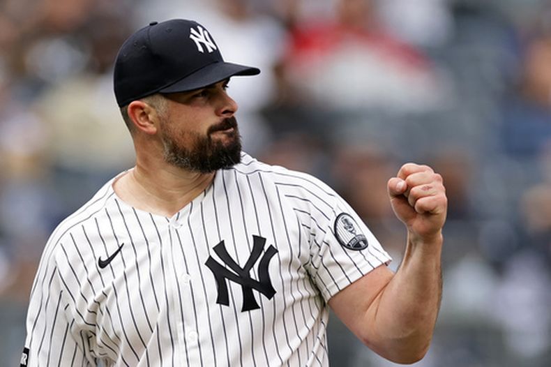 El abridor Carlos Rodón de los Yankees de Nueva York reacciona tras sacar el último out en el séptimo inning ante los Rays de Tampa Bay, el martes 22 de septiembre de 2026, en Nueva York. (AP Foto/Adam Hunger)