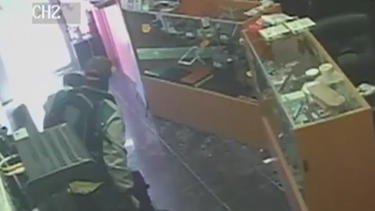 americateve | ROBAN EN TIENDA DE CELULARES.png