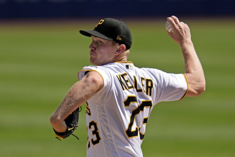 Mitch Keller de los Piratas de Pittsburgh lanza durante el primer inning del juego ante los Nacionales de Washington, el jueves 14 de septiembre de 2023. (AP Foto/Gene J. Puskar)