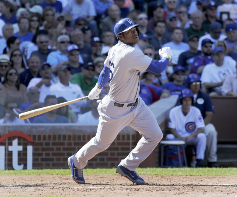 El jugador cubano de los Dodgers, Yasiel Puig, batea en un partido el 19 de septiembre de 2014 en Chicago. Un empresario del sur de la Florida se declar&oacute; culpable el 16 de diciembre de 2014 por participar en el contrabando de personas, incluyendo a