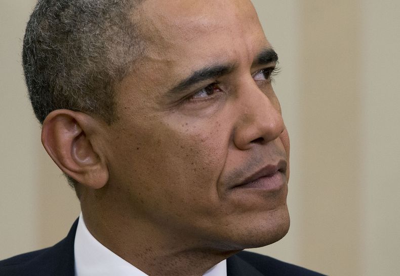 El presidente estadounidense Barack Obama escucha una pregunta de la prensa sobre la situaci&oacute;n en Ucrania, el lunes 3 de marzo del 2014, en la Casa Blanca. (Foto AP/Pablo Martinez Monsivais)