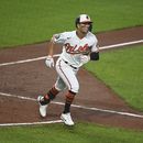 Orioles frenan a Mellizos, con jonrones de Mullins y Urías
