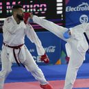 El dominicano Anel Castillo repele una patada del colombiano Diego Lenis en el combate de karate, división de más de 84 kilogramos, de los Juegos Centroamericanos y del Caribe en San Salvador, el sábado 8 de julio de 2023 (AP Foto/Arnulfo Franco)