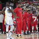 Fuente AP: Green riñe con Poole en práctica de Warriors