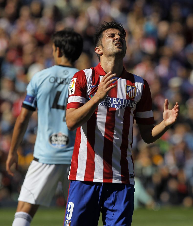 El delantero de Atl&eacute;tico de Madrid David Villa durante el partido contra Celta de Vigo en Madrid el 6 de octubre del 2013. Villa se lesion&oacute; durante el partido y se anunci&oacute; que no podr&aacute; jugar para la selecci&oacute;n espa&ntilde