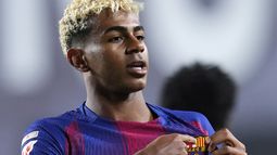 Lamine Yamal celebra tras anotar un gol de penal para el Barcelona durante el partido contra el Rayo Vallecano en la Liga española, el domingo 31 de agosto de 2025, en Madrid. (AP Photo/Manu Fernández)
