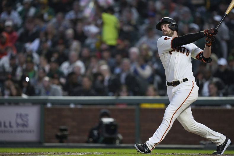 San Francisco Giants Austin Slater watches his two-run home run against the Oakland Athletics during the sixth inning of a baseball game Wednesday, July 26, 2023, in San Francisco. (AP Photo/Godofredo A. Vásquez)