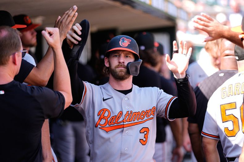 Taylor Ward (3), de los Orioles de Baltimore, celebra después de anotar frente a los Tigres de Detroit durante la 12ma entrada del juego de béisbol de Grandes Ligas contra los Tigres de Detroit, el miércoles 29 de julio de 2026, en Detroit. (AP Foto/Paul Sancya)