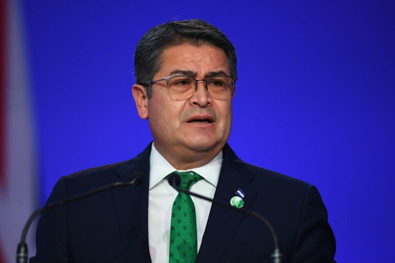 ARCHIVO - El presidente de Honduras, Juan Orlando Hernández, habla durante la ceremonia de apertura de la Conferencia de Cambio Climático COP26 en Glasgow, Escocia, el lunes 1 de noviembre de 2021. (Andy Buchanan/Pool via AP, Achivo)