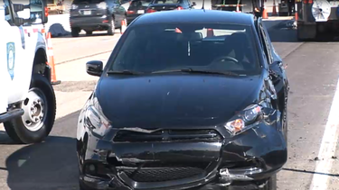 grua cae sobre un auto en el palmetto