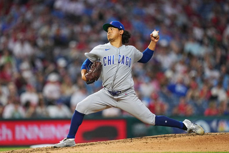 Shota Imanaga, lanzador de los Cachorros de Chicago, trabaja durante la cuarta entrada del juego de béisbol de Grandes Ligas contra los Filis de Filadelfia, el miércoles 15 de abril de 2026, en Filadelfia. (AP Foto/Matt Rourke)