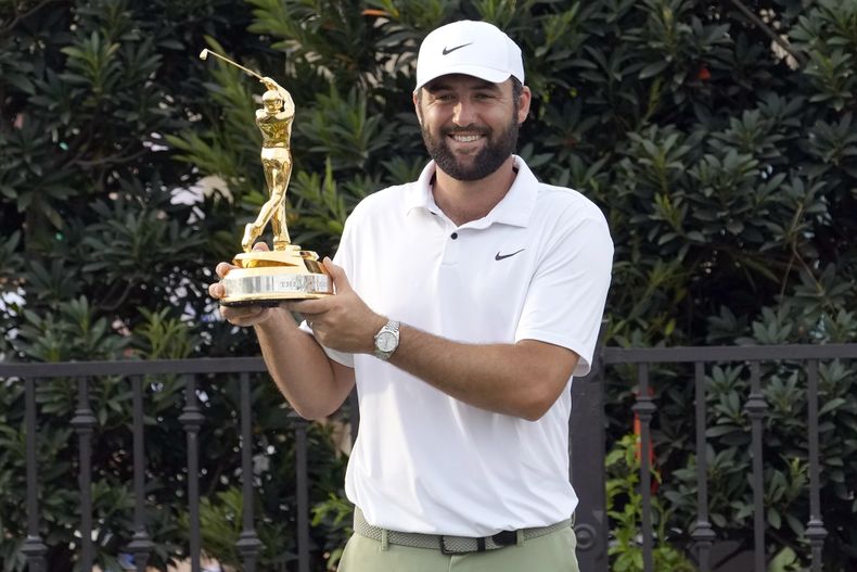 Scottie Scheffler celebra después de ganar el torneo de golf The Players Championship, el domingo 17 de marzo de 2024, en Ponte Vedra Beach, Florida. (AP Foto/Lynne Sladky)