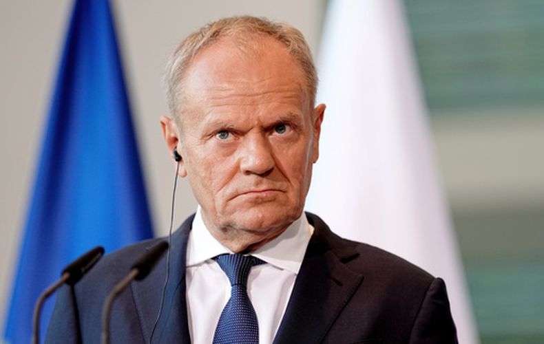 ARCHIVO - El primer ministro polaco, Donald Tusk, mira durante una conferencia de prensa durante la cumbre E5 de naciones europeas antes de una cumbre de la OTAN en Berlín, el miércoles 24 de junio de 2026. (Kay Nietfeld/dpa via AP,File)