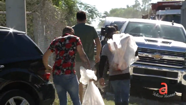 largas filas en el popular matadero cabrera: decenas de personas llegan a comprar su lechon de nochebuena