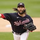 El abridor de los Nacionales de Washington Trevor Williams lanza en la primera entrada del encuentro ante los Cardenales de San Luis el miércoles 21 de junio del 2023. (AP Foto/Andrew Harnik)