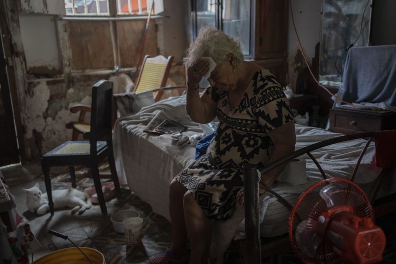 Margarita Salazar, 82, wipes the sweat off with a tissue inside her home amid high heat in Veracruz, Mexico, on June 16, 2024. Human-caused climate change intensified and made far more likely this months killer heat with triple digit temperatures, a new flash study found Thursday, June 20. (AP Photo/Felix Marquez)