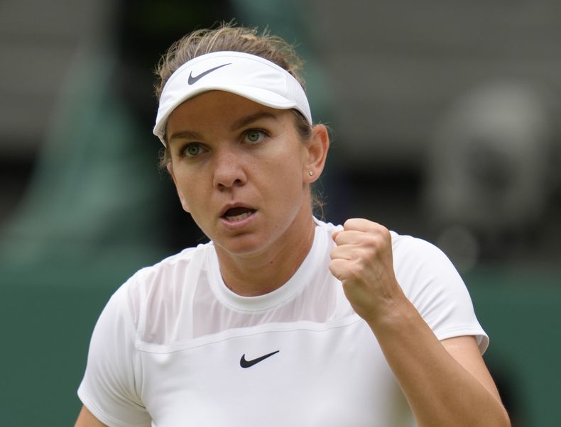 ARCHIVO - La rumana Simona Halep festeja durante su partido ante la estadounidense Amanda Anisimova, en Wimbledon, el 6 de julio de 2022 (AP Foto/Kirsty Wigglesworth, archivo)