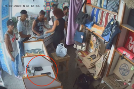 camara de seguridad capta el momento del robo de un celular en una tienda de ropa en el cerro