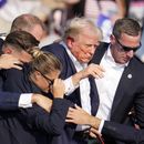Agentes del Servicio Secreto se llevan al candidato presidencial republicano Donald Trump del escenario tras recibir un disparo durante un acto de campaña, el 13 de julio de 2024, en Butler, Pensilvania. (AP Foto/Gene J. Puskar)