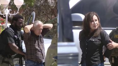 This image taken from video provided by KFOX14 shows former Doña Ana County Magistrate Judge Jose Luis Joel Cano, left, and his wife, Nancy Cano, being arrested Thursday, April 24, 2025, in Las Cruces, N.M. (KFOX14 via AP)