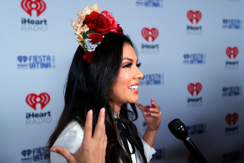 ARCHIVO - Lupita Infante da una entrevista en la alfombra roja de la iHeartRadio Fiesta Latina 2019, el 2 de noviembre de 2019, en Miami. (Foto AP/Luis M. Alvarez, archivo)
